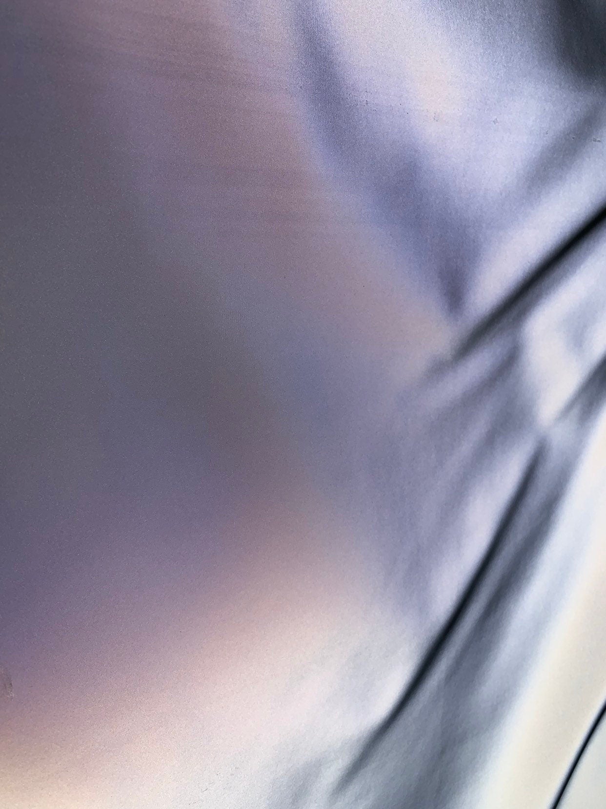 Reflective vinyl iridescent silver non stretch vinyl 58/60" Sold by the YD. Ships worldwide from Los Angeles California USA.