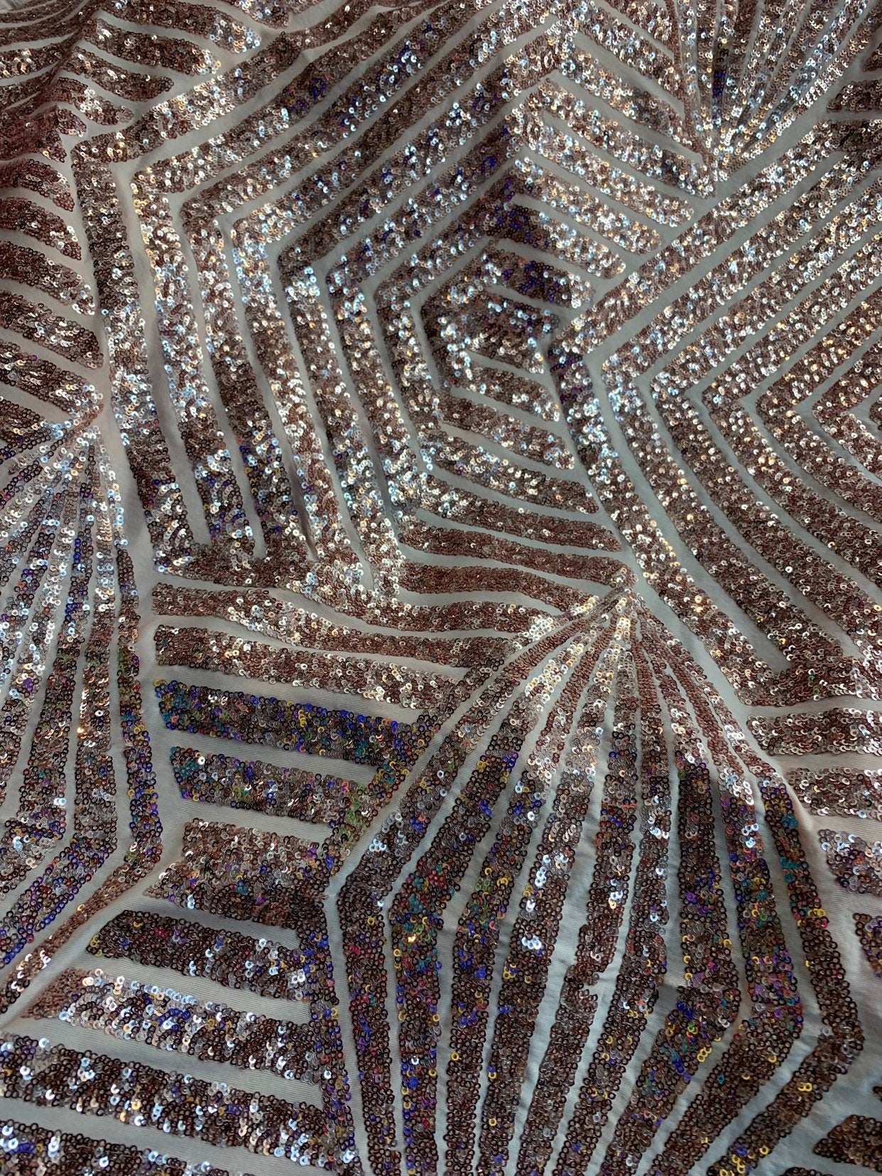 Jennifer design mini glitz sequins rose gold on spandex base 2way stretch 55/57" Sold by the YD. Ships worldwide from Los Angeles California