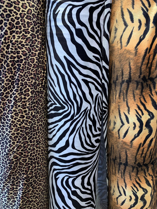 Heavy stretch velvet multi animal print 4way stretch 58/60" Sold by the YD. Ships worldwide from Los Angeles California USA.