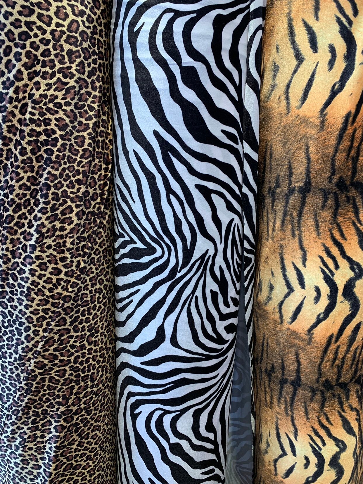 Heavy stretch velvet multi animal print 4way stretch 58/60" Sold by the YD. Ships worldwide from Los Angeles California USA.