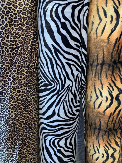 Heavy stretch velvet multi animal print 4way stretch 58/60" Sold by the YD. Ships worldwide from Los Angeles California USA.