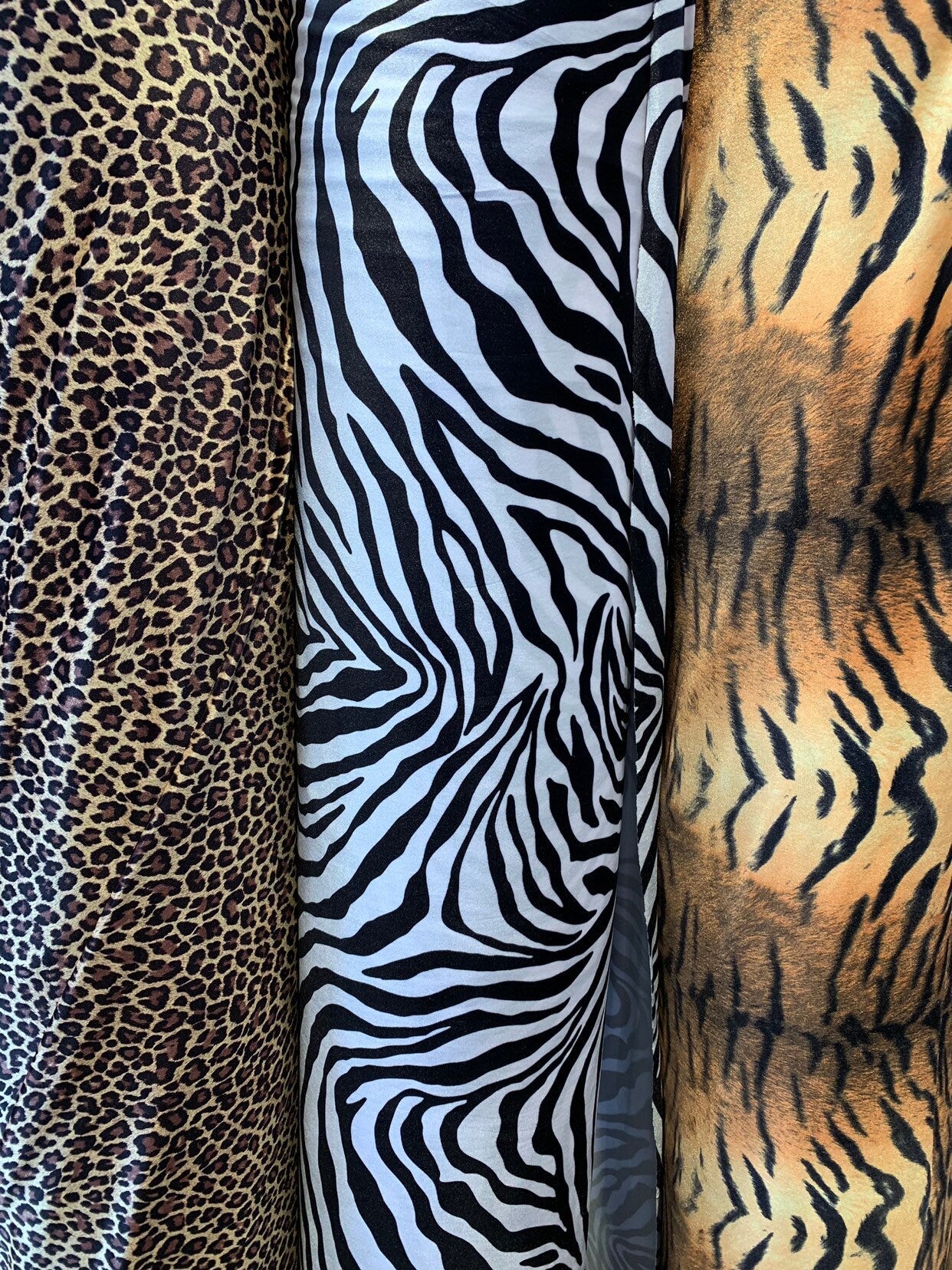 Heavy stretch velvet multi animal print 4way stretch 58/60" Sold by the YD. Ships worldwide from Los Angeles California USA.