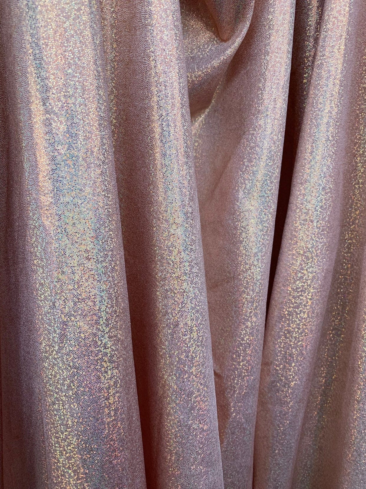 Rose gold hologram foggy foil metallic nylon spandex with foggy foil 4way stretch 58/60" Sold by the YD. Ships worldwide from Los Angeles CA