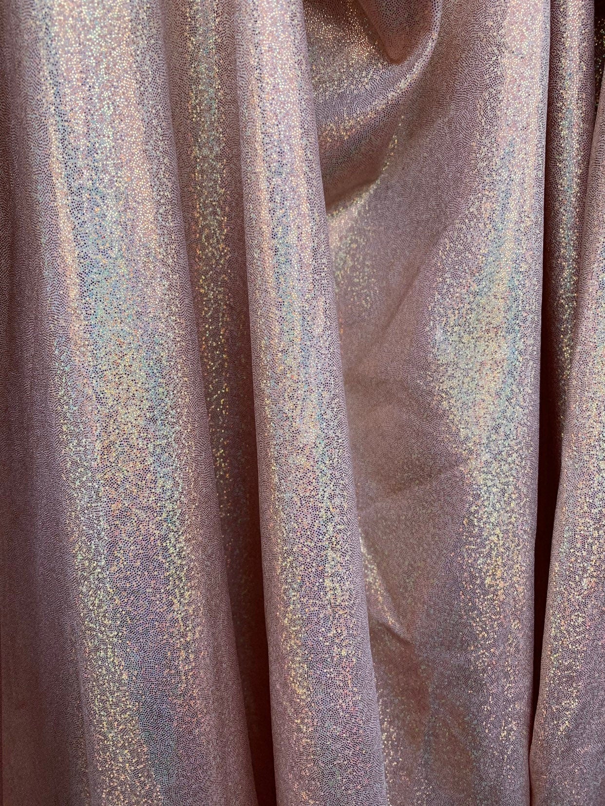 Rose gold hologram foggy foil metallic nylon spandex with foggy foil 4way stretch 58/60" Sold by the YD. Ships worldwide from Los Angeles CA