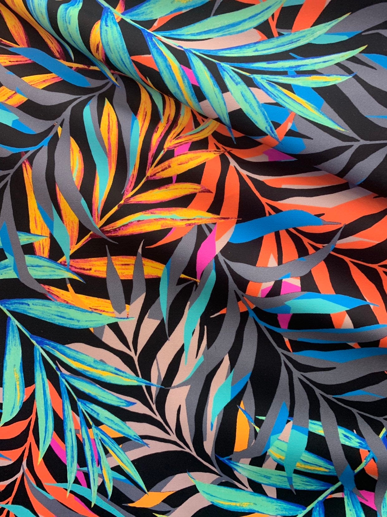 NewJungle leaf design 58/60" 4-Way Stretch Nylon Spandex Print with fine and smooth texture. Sold by the YD. Ships worldwide from L.A CA.