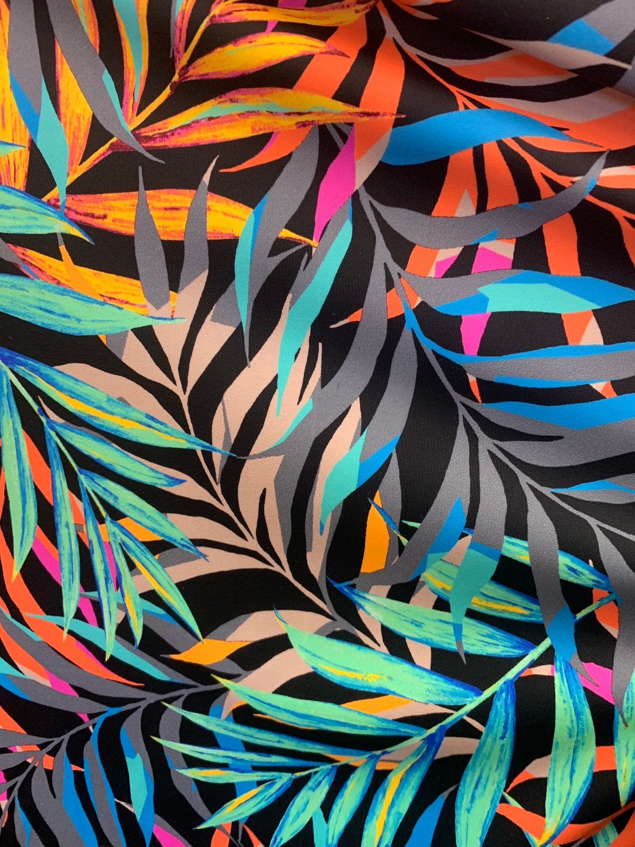 NewJungle leaf design 58/60" 4-Way Stretch Nylon Spandex Print with fine and smooth texture. Sold by the YD. Ships worldwide from L.A CA.