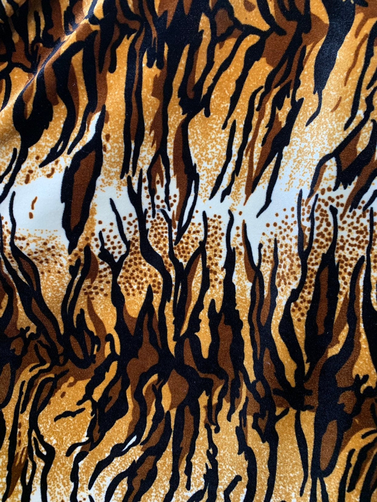New tiger design  brown/gold heavy stretch velvet 4way 420 gsm 58/60" Sold by the YD. Ships worldwide from Los Angeles California USA.