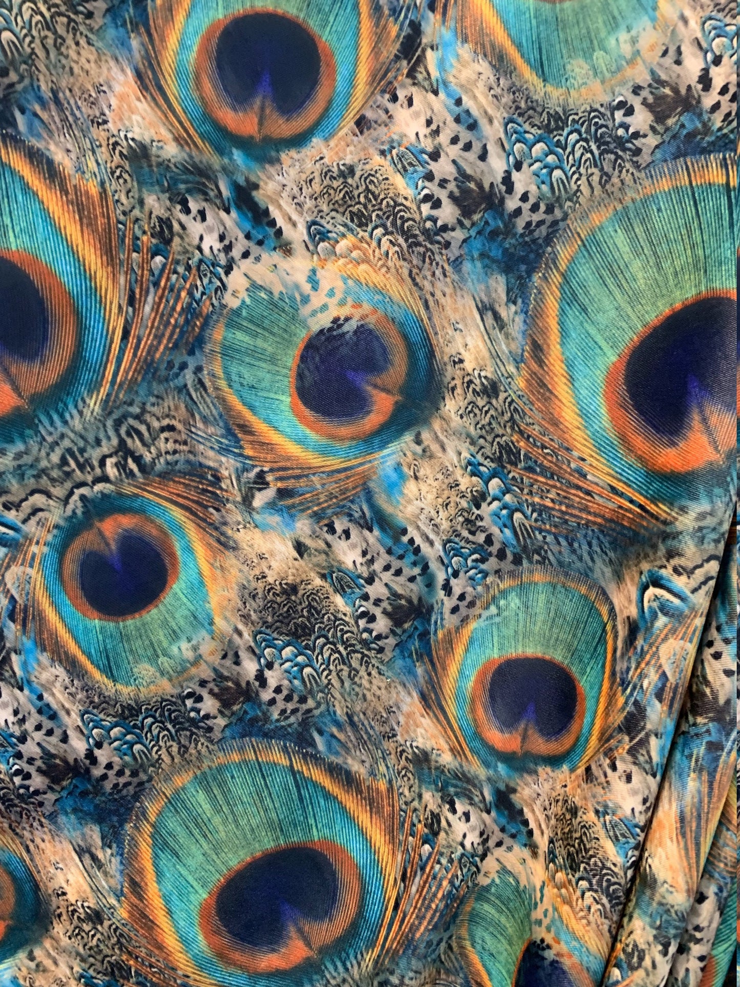 Exotic Peacock design Multicolors in nylon spandex  4way stretch 58/60" Sold by the YD. Ships worldwide from Los Angeles California USA