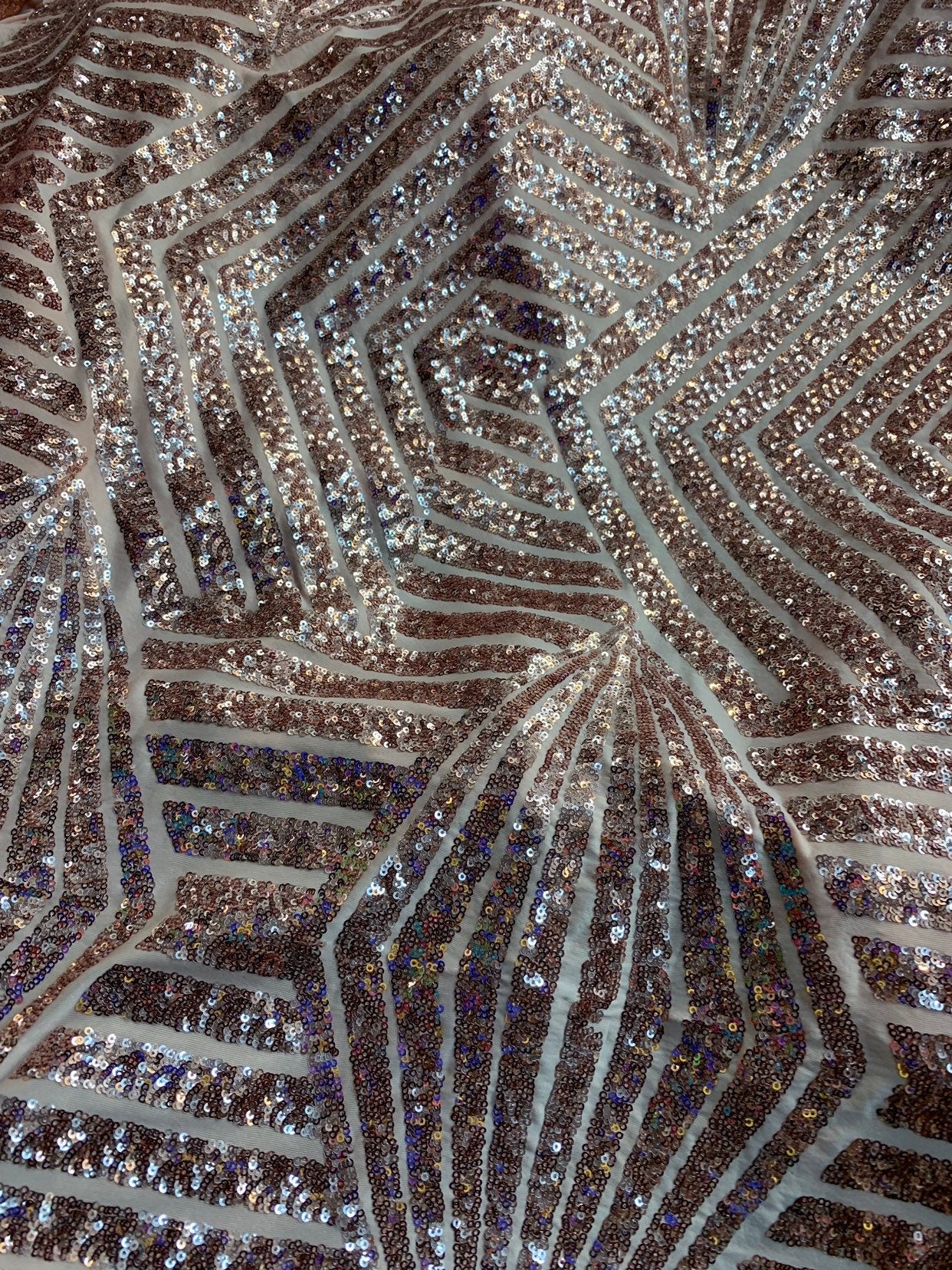 Jennifer design mini glitz sequins rose gold on spandex base 2way stretch 55/57" Sold by the YD. Ships worldwide from Los Angeles California