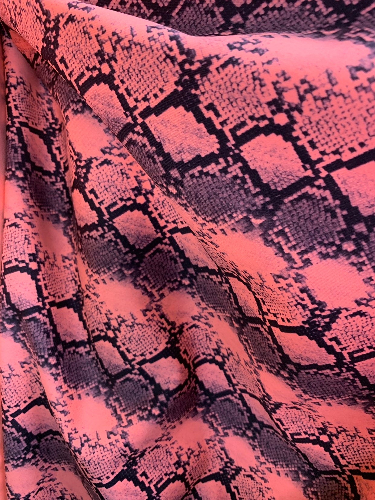 New exotic snake design print on heavyweight nylon spandex 4way stretch 58/60" Sold by the YD. Ships worldwide from Los Angeles California.