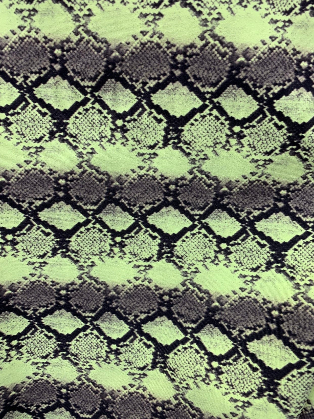 New exotic snake design print on heavyweight nylon spandex 4way stretch 58/60" Sold by the YD. Ships worldwide from Los Angeles California.