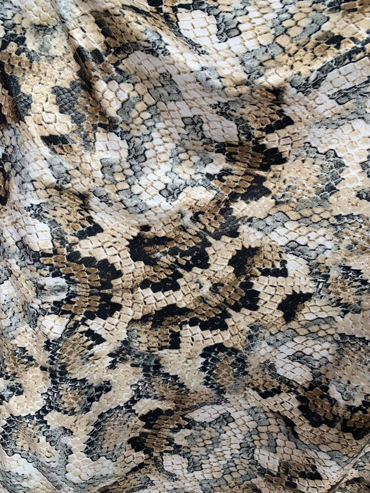 New Snake design print ok spandex fabric 2way stretch 58/60" Sold by the YD. Ships worldwide from Los Angeles California USA.