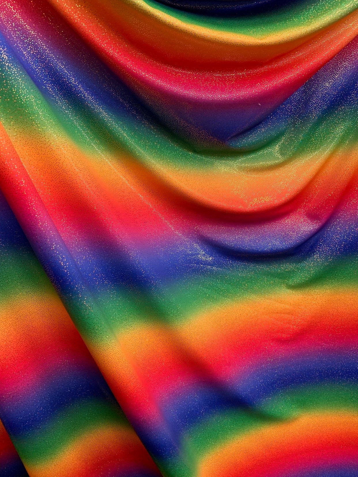 New rainbow heavy nylon spandex with foggy foil all over 4way stretch 58/60" Sold by the YD. Ships worldwide from Los Angeles California USA