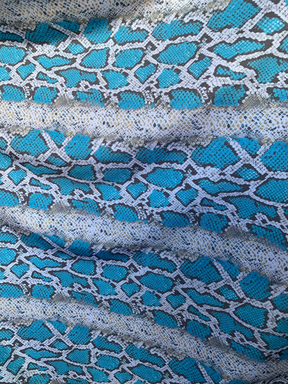 New snake print white/blue/gray  print on nylon spandex 4way stretch 58/60" Sold by the YD. Ships worldwide from Los Angeles California USA.