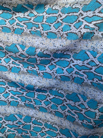 New snake print white/blue/gray  print on nylon spandex 4way stretch 58/60" Sold by the YD. Ships worldwide from Los Angeles California USA.