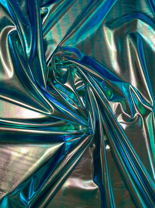 New blue green iridescent foil metallic spandex foil 4way stretch 58/60" Sold by the YD. Ships worldwide from Los Angeles California USA.