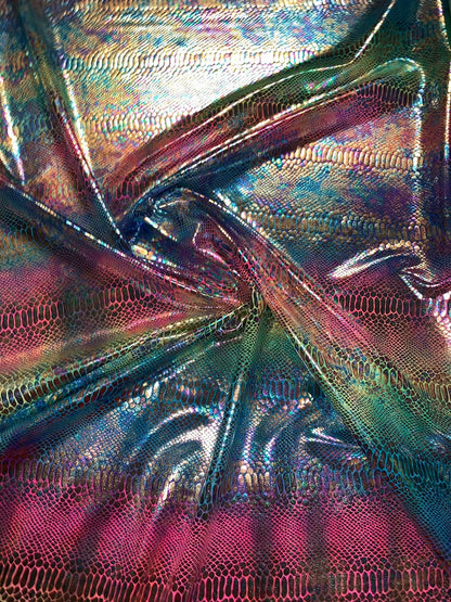 New Iridescent rainbow hologram snake design with tie dye ilusión foil 4way stretch 58/60" Sold by the YD. Ships worldwide from Los Angeles