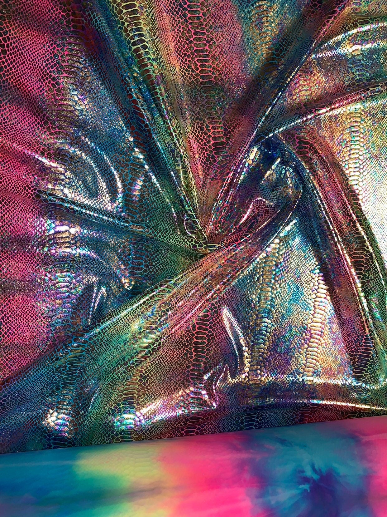 New Iridescent rainbow hologram snake design with tie dye ilusión foil 4way stretch 58/60" Sold by the YD. Ships worldwide from Los Angeles