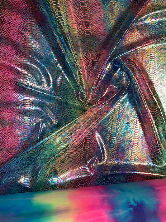 New Iridescent rainbow hologram snake design with tie dye ilusión foil 4way stretch 58/60" Sold by the YD. Ships worldwide from Los Angeles