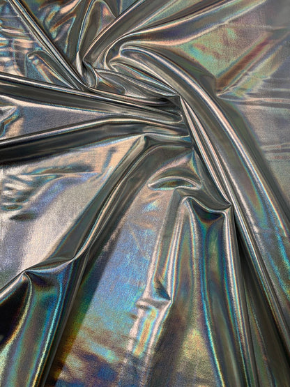 Iridescent silver all over foil metallic nylon Spandex 4way stretch 58/60" Sold by the YD. Ships worldwide from Los Angeles California USA