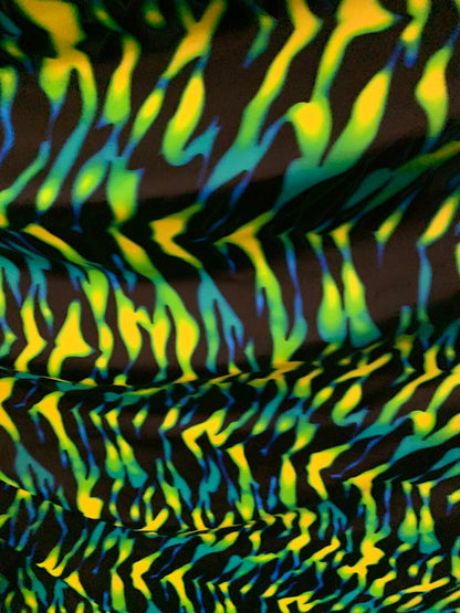 New tiger camouflage design black/green/yellow print on heavy nylon spandex 4way stretch 58/60" Sold by the YD. Ships worldwide from L.A CA.