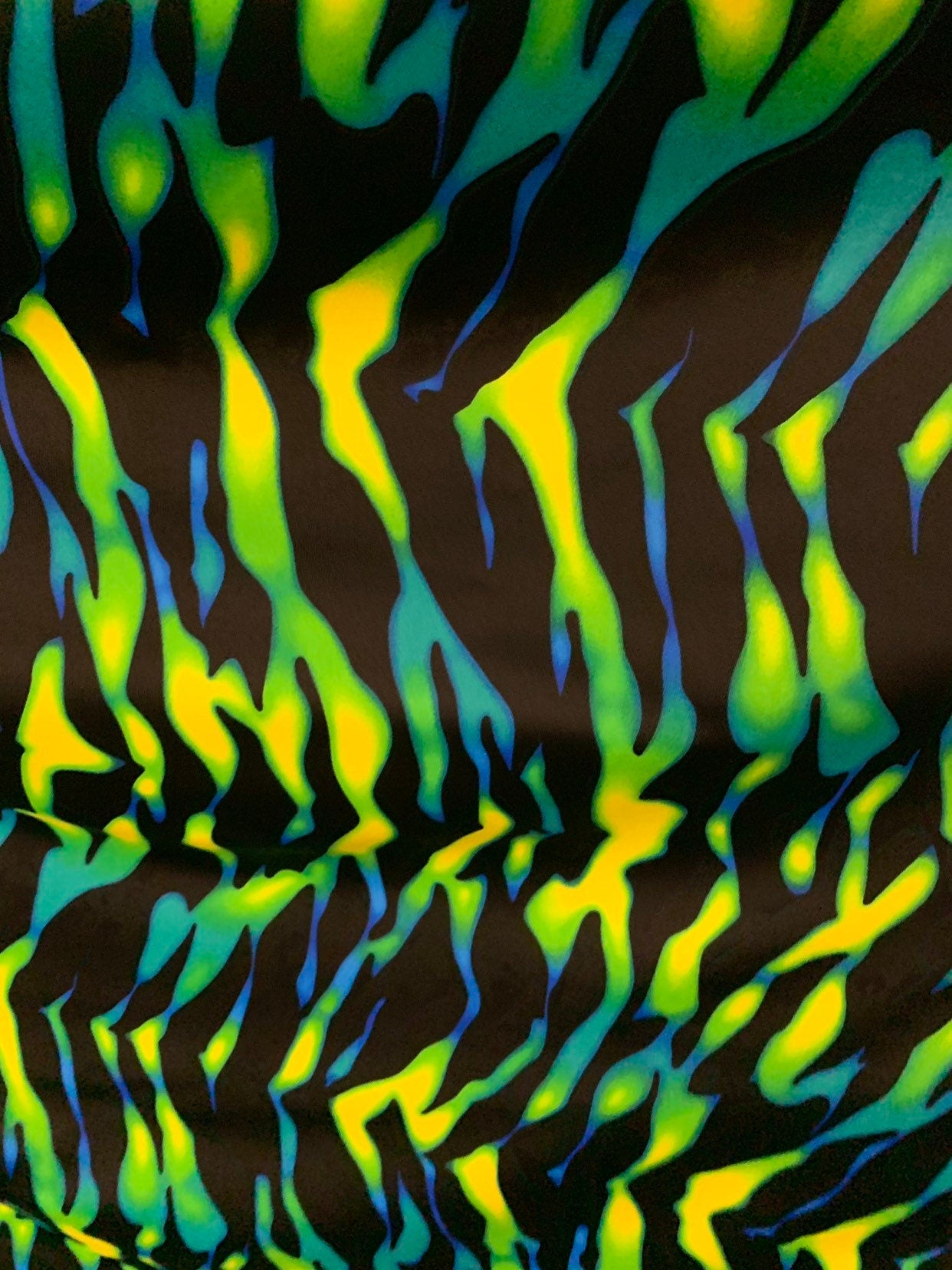 New tiger camouflage design black/green/yellow print on heavy nylon spandex 4way stretch 58/60" Sold by the YD. Ships worldwide from L.A CA.