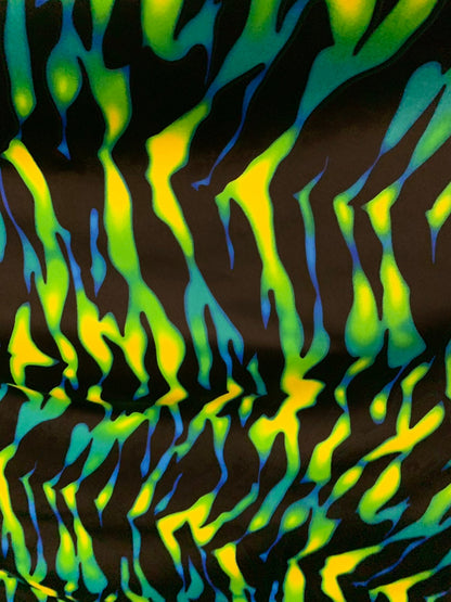 New tiger camouflage design black/green/yellow print on heavy nylon spandex 4way stretch 58/60" Sold by the YD. Ships worldwide from L.A CA.