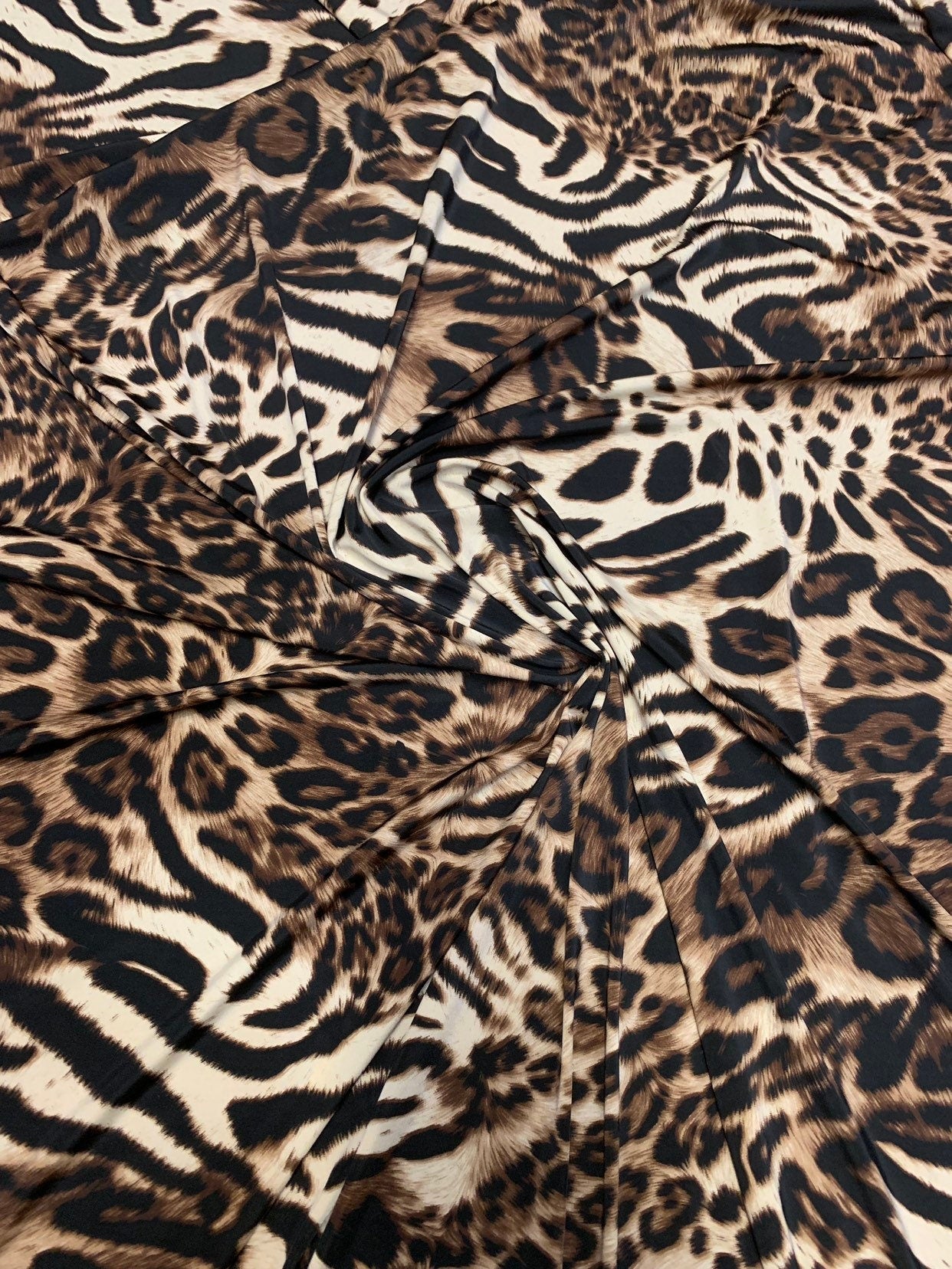 New exotic leopard animal print brown/taupe 4way stretch Nylon spandex 58/60" Sold by the YD. Ships worldwide from Los Angeles California.