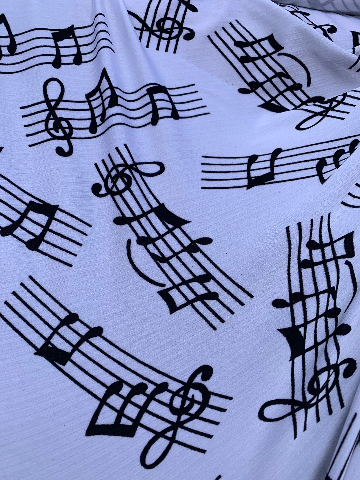 Music Notes design print on heavy nylon spandex 4way stretch 58/60" Sold by the YD. Ships worldwide from Los Angeles California USA.