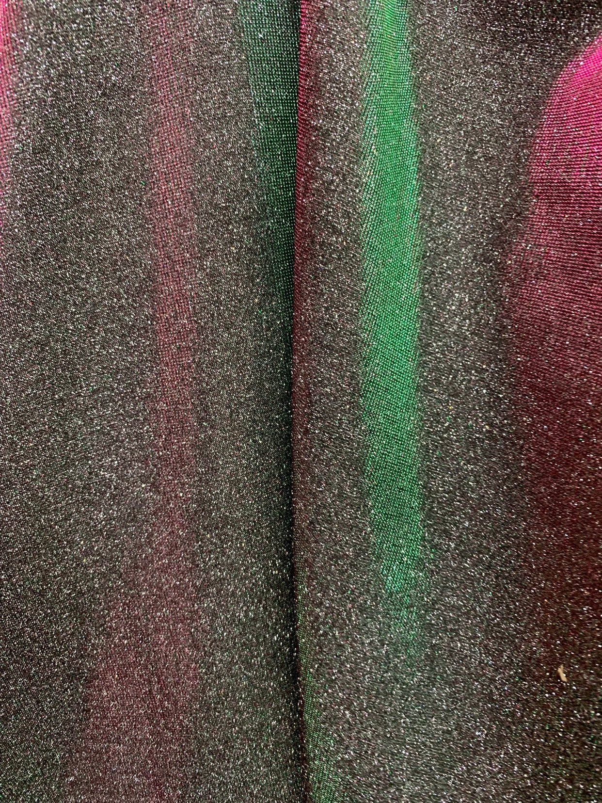 New Iridescent heavy metallic poly super techno fabric 4 way stretch 58/60" Sold by the YD. Ships worldwide from Los Angeles California USA.