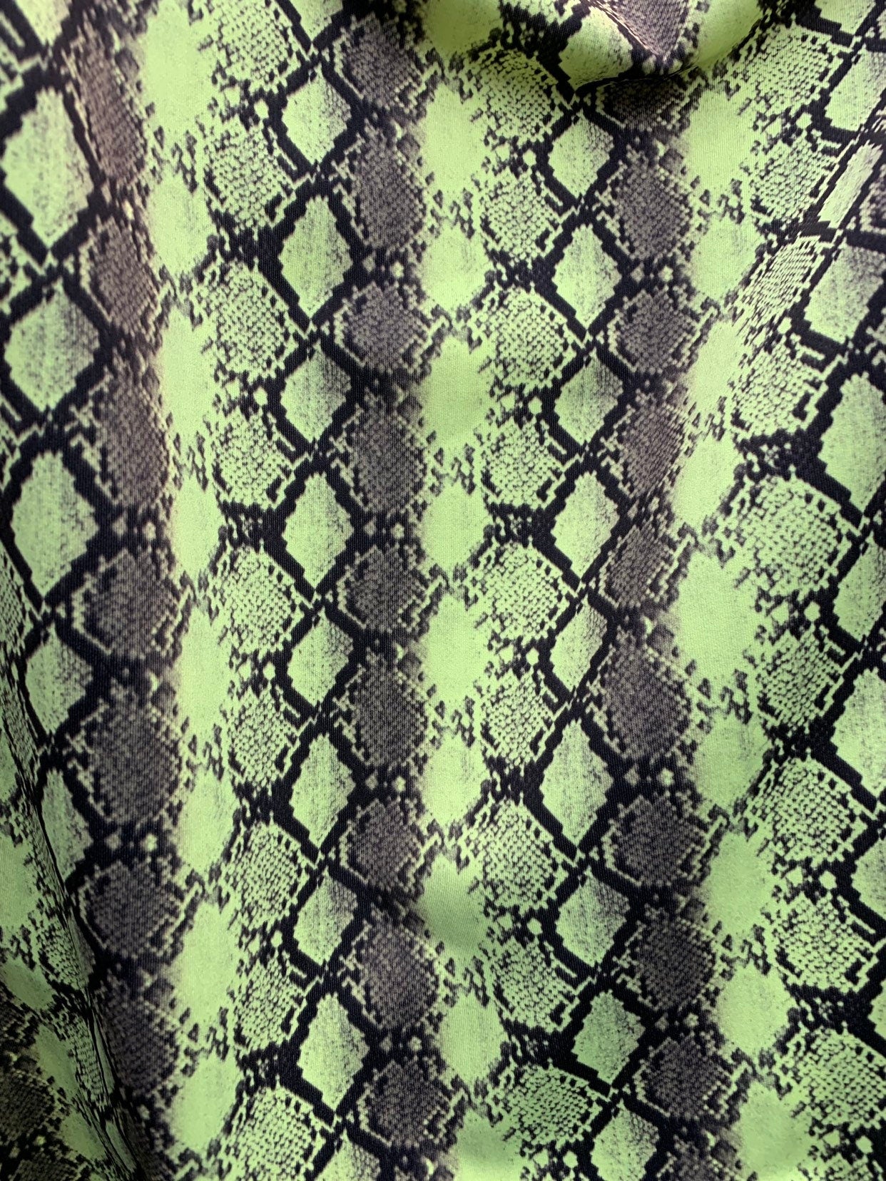 New exotic snake design print on heavyweight nylon spandex 4way stretch 58/60" Sold by the YD. Ships worldwide from Los Angeles California.