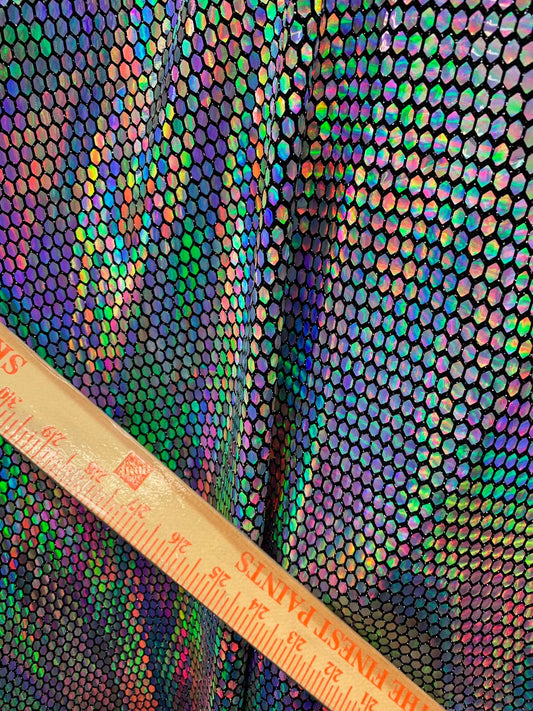 New hexagon hologram sequins on metallic spandex base 4way stretch 58/60" Sold by the YD. Ships worldwide from Los Angeles California USA.