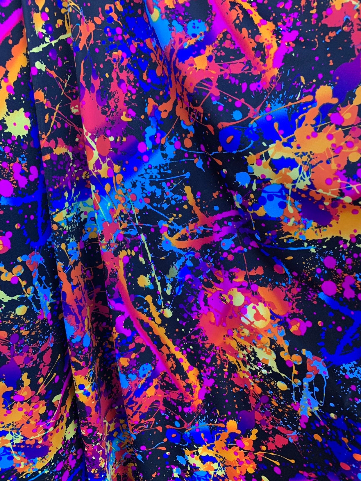 Graffiti paint design nylon spandex with foggy foil  4-way stretch. 58/60" sold by the YD. Ships worldwide from Los Angeles California USA