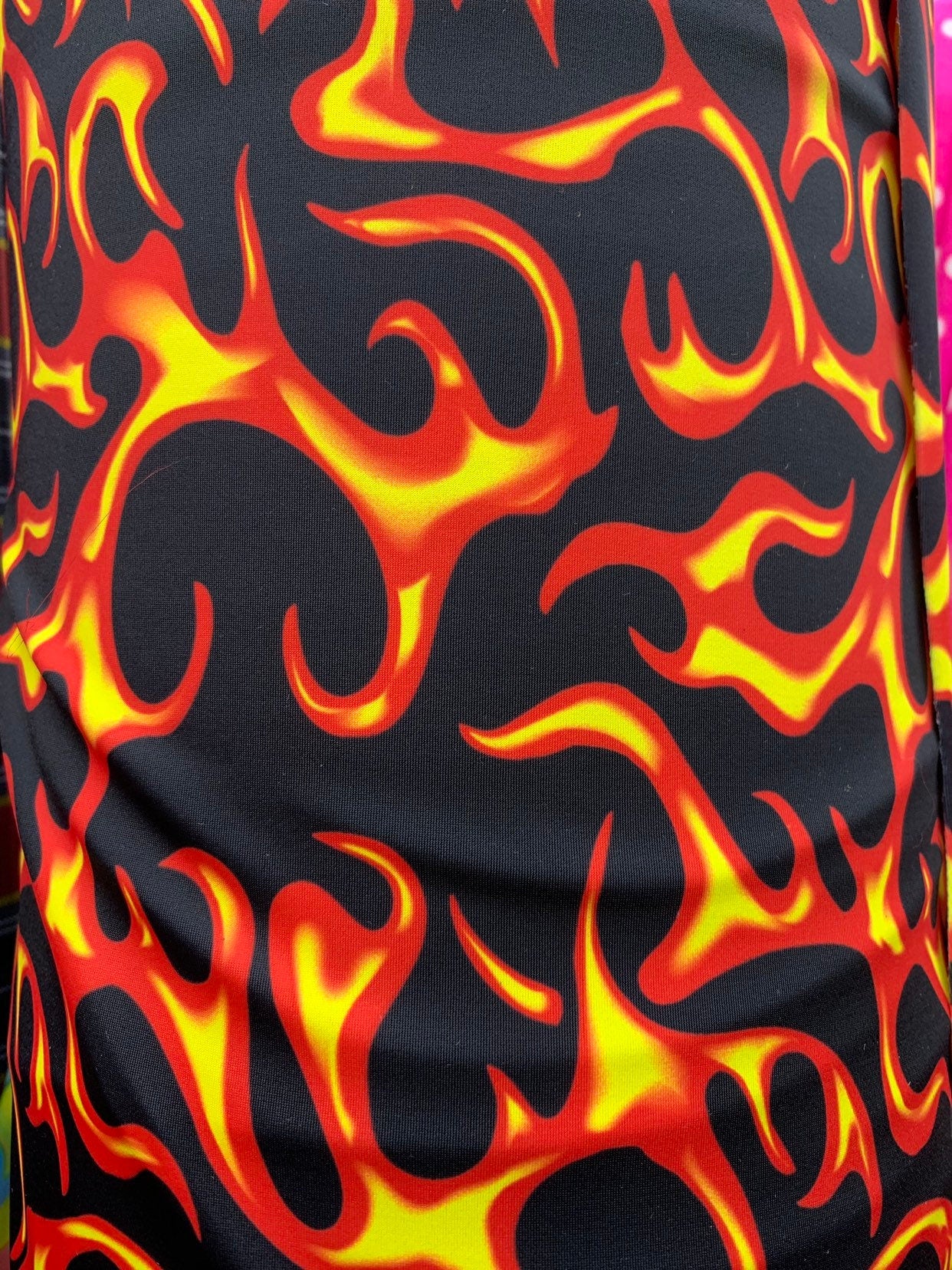 Hot flame design black/red print on heavy nylon spandex 4way stretch 58/60" Sold by the YD. Ships worldwide from Los Angeles California USA.