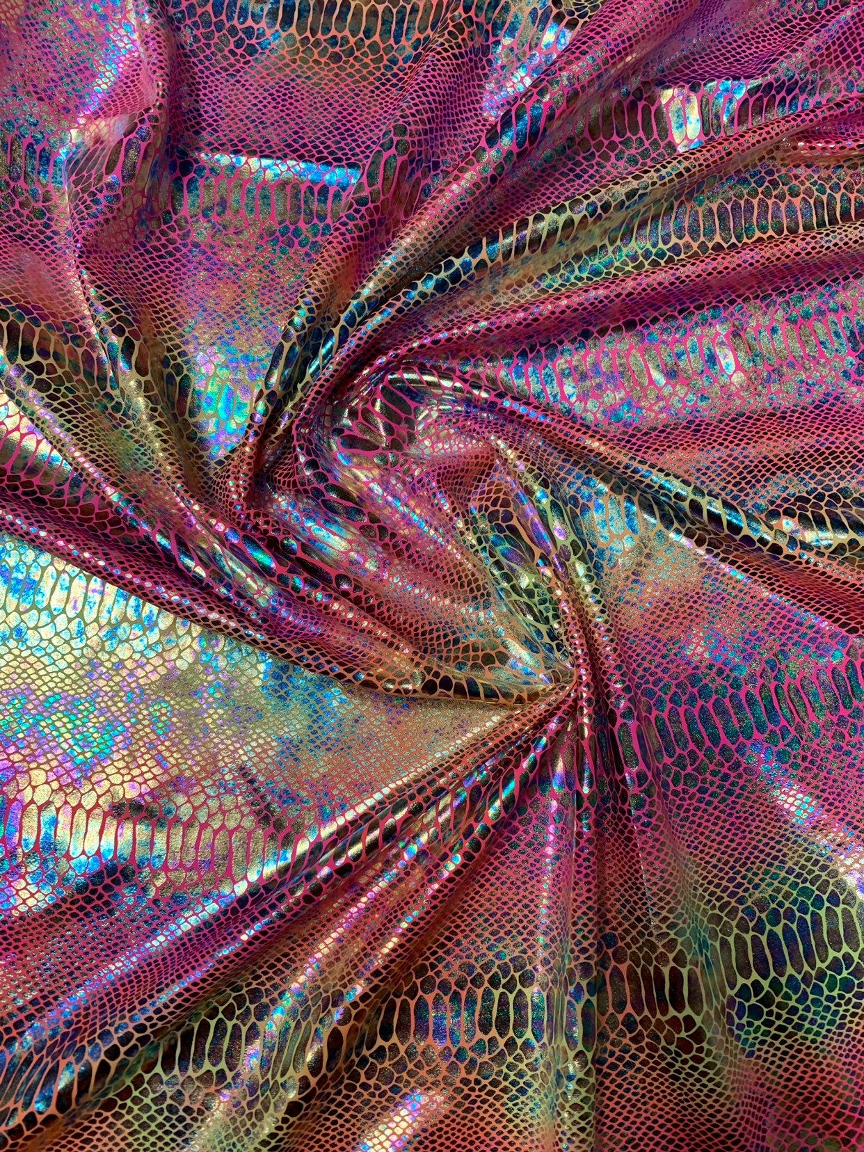 New Iridescent hologram snake design with clear multicolor foil 4way stretch 58/60" Sold by the YD. Ships worldwide from Los Angeles CA USA.