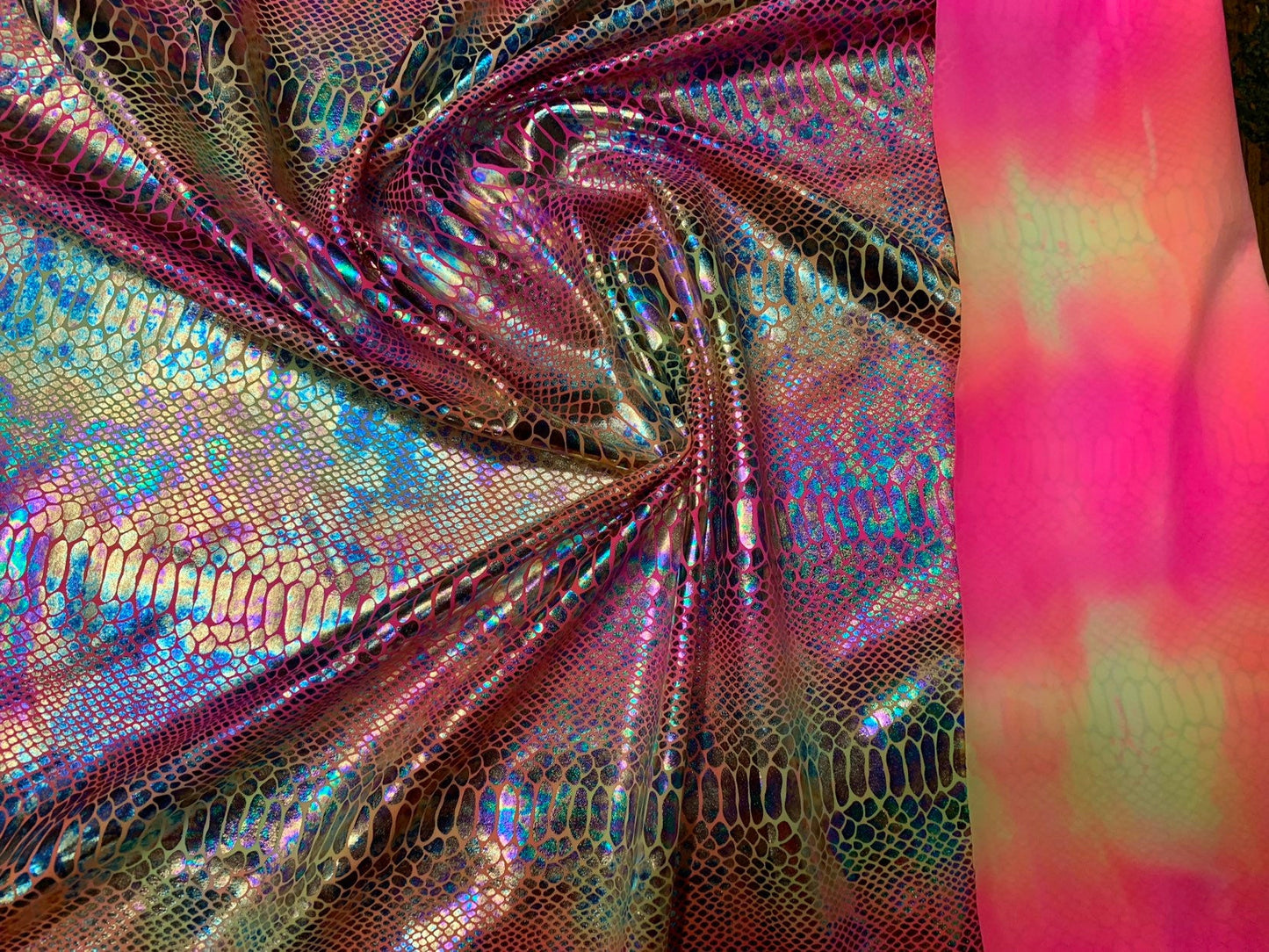 New Iridescent hologram snake design with clear multicolor foil 4way stretch 58/60" Sold by the YD. Ships worldwide from Los Angeles CA USA.