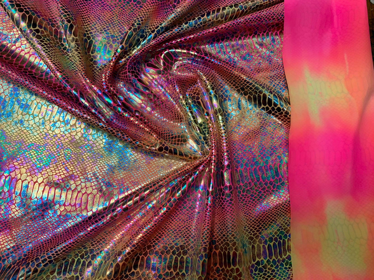 New Iridescent hologram snake design with clear multicolor foil 4way stretch 58/60" Sold by the YD. Ships worldwide from Los Angeles CA USA.