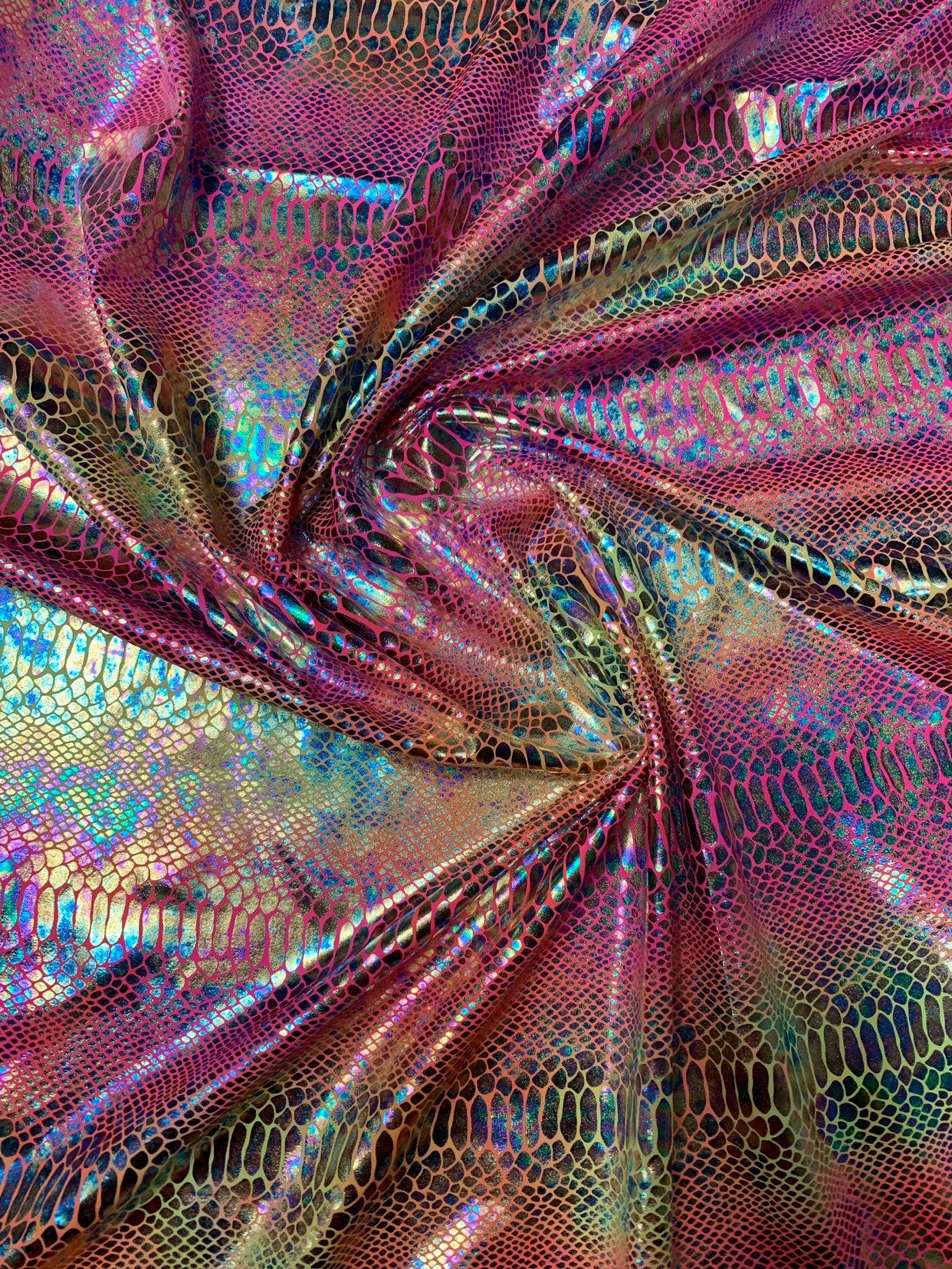 New Iridescent hologram snake design with clear multicolor foil 4way stretch 58/60" Sold by the YD. Ships worldwide from Los Angeles CA USA.