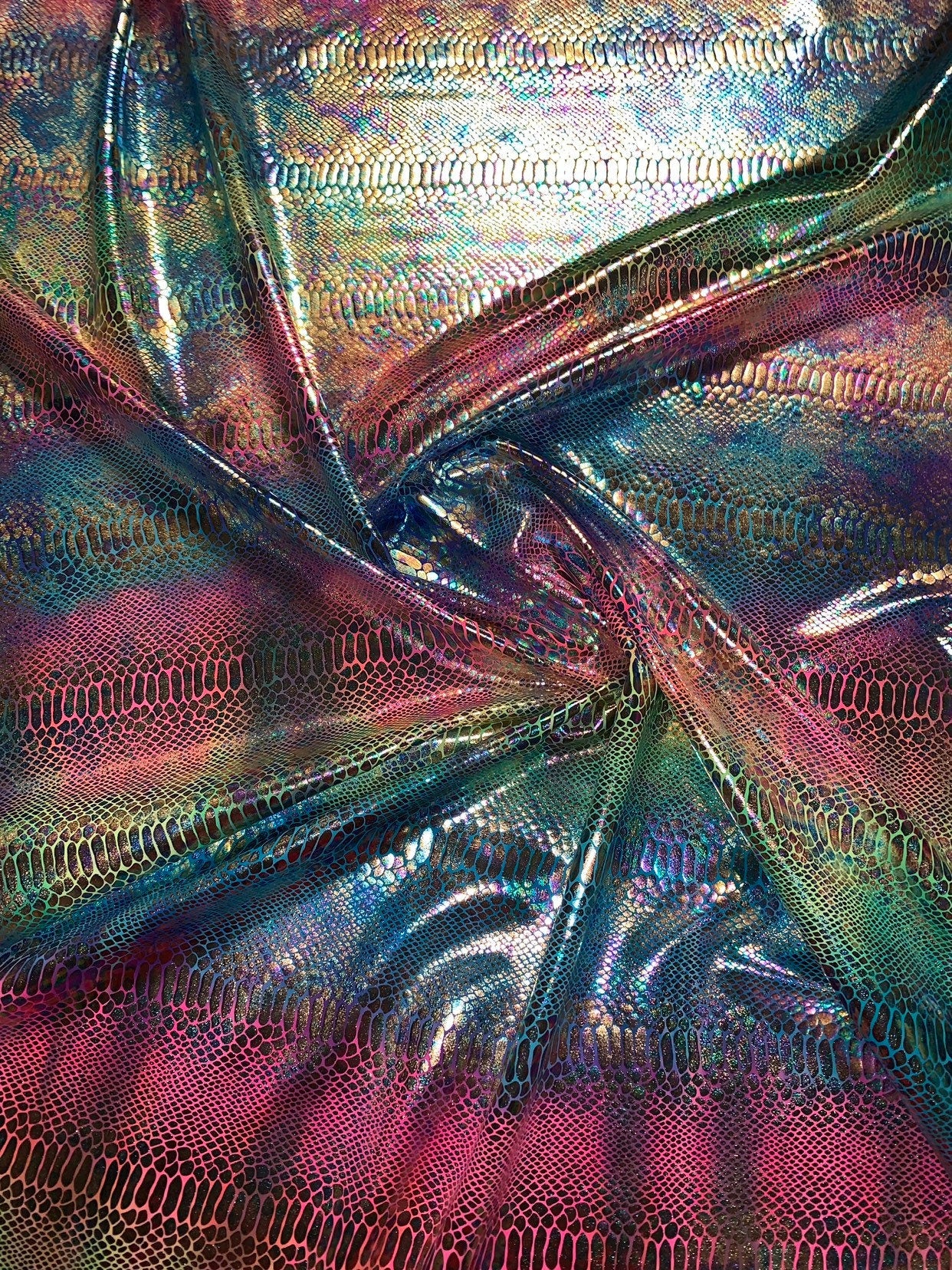 New Iridescent rainbow hologram snake design with tie dye ilusión foil 4way stretch 58/60" Sold by the YD. Ships worldwide from Los Angeles