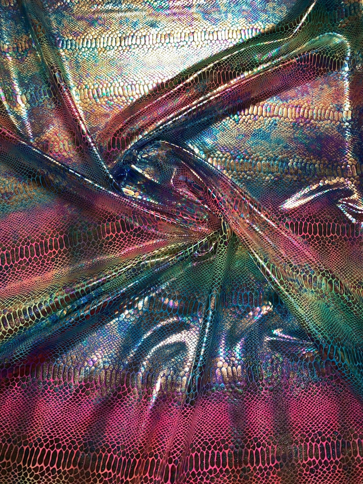 New Iridescent rainbow hologram snake design with tie dye ilusión foil 4way stretch 58/60" Sold by the YD. Ships worldwide from Los Angeles