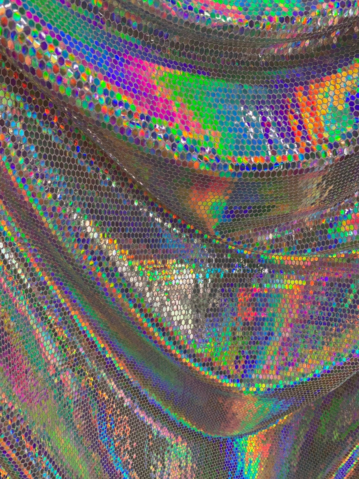 New hexagon geometric iridescent sequins on metallic spandex base 4way stretch 58/60" Sold by the YD. Ships worldwide from Los Angeles CA.