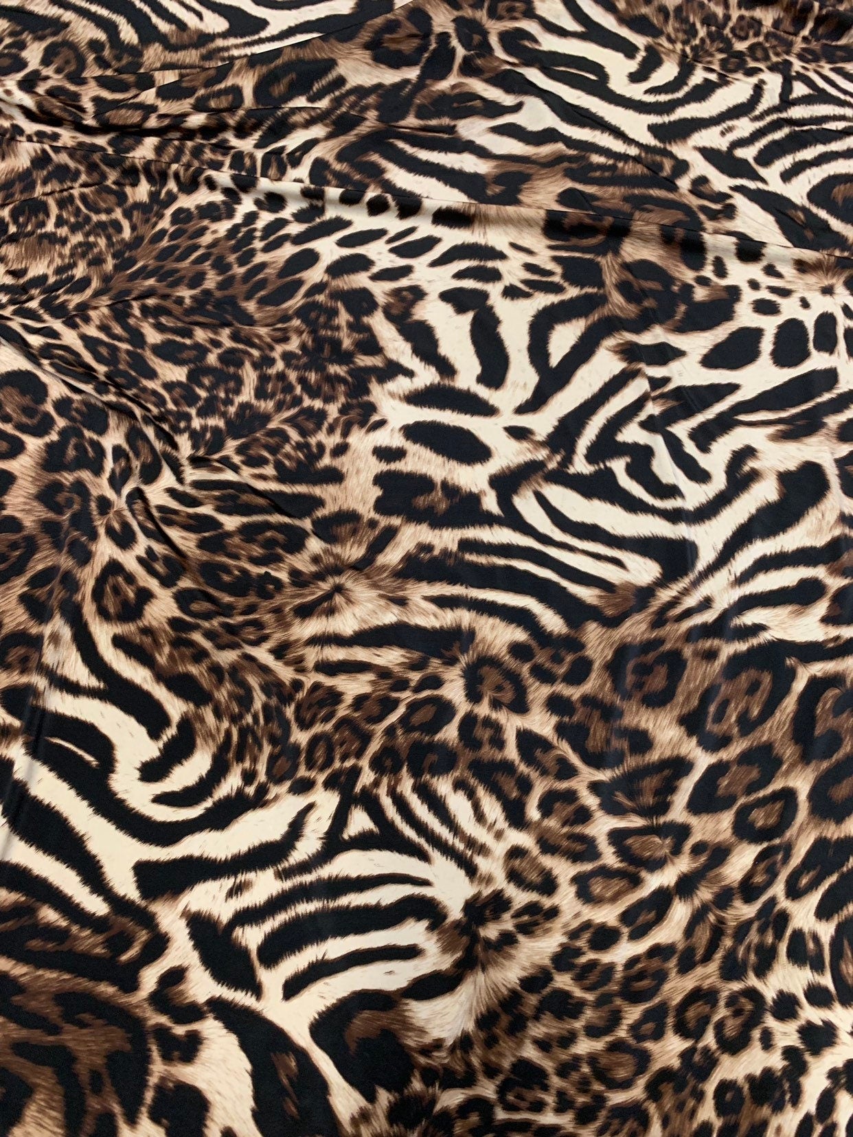 New exotic leopard animal print brown/taupe 4way stretch Nylon spandex 58/60" Sold by the YD. Ships worldwide from Los Angeles California.