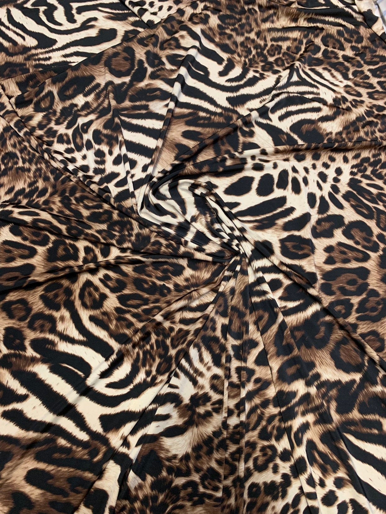 New exotic leopard animal print brown/taupe 4way stretch Nylon spandex 58/60" Sold by the YD. Ships worldwide from Los Angeles California.