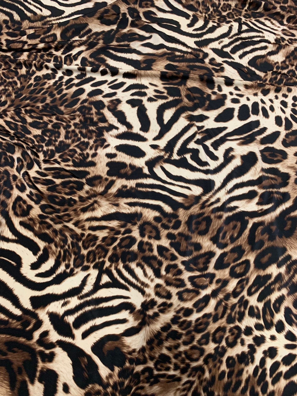 New exotic leopard animal print brown/taupe 4way stretch Nylon spandex 58/60" Sold by the YD. Ships worldwide from Los Angeles California.