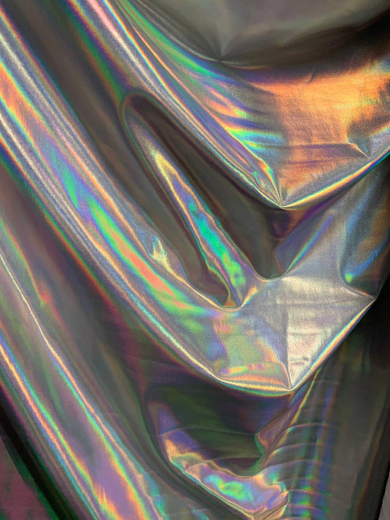 NEW Iridescent all over foil on nylon spandex 4way stretch 58/60" Shining Iridescent foil white/silver Sold by the YD. Ships worldwide.