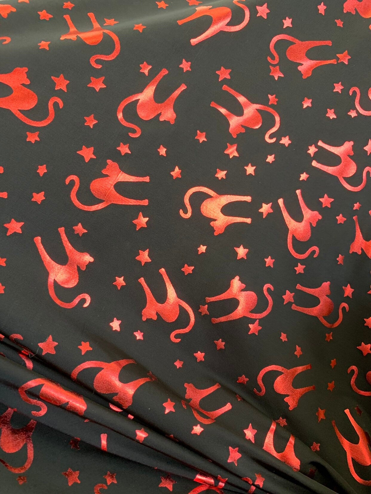 New Halloween cat design Metallic spandex 4way stretch 58/60" Sold by the YD. Ships worldwide from Los Angeles California USA.