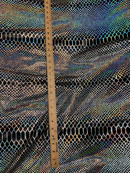 Dragón design Iridescent two tone hologram metallic nylon spandex 4way stretch 58/60" Sold by the YD. Ships worldwide from Los Angeles CA.