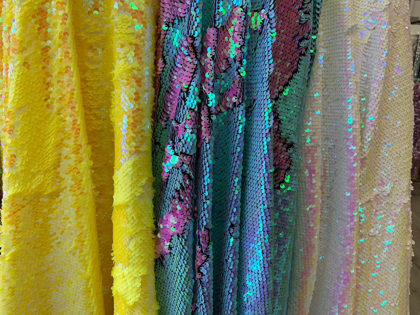 New flip up mermaid reversible sequins iridescent colors on spandex base 58/60" Sold by the YD. Ships worldwide from Los Angeles California
