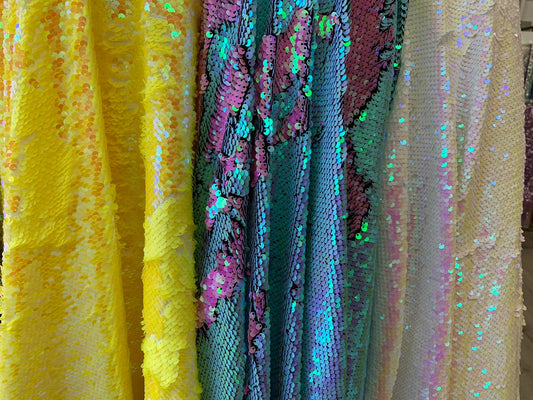 New flip up mermaid reversible sequins iridescent colors on spandex base 58/60" Sold by the YD. Ships worldwide from Los Angeles California