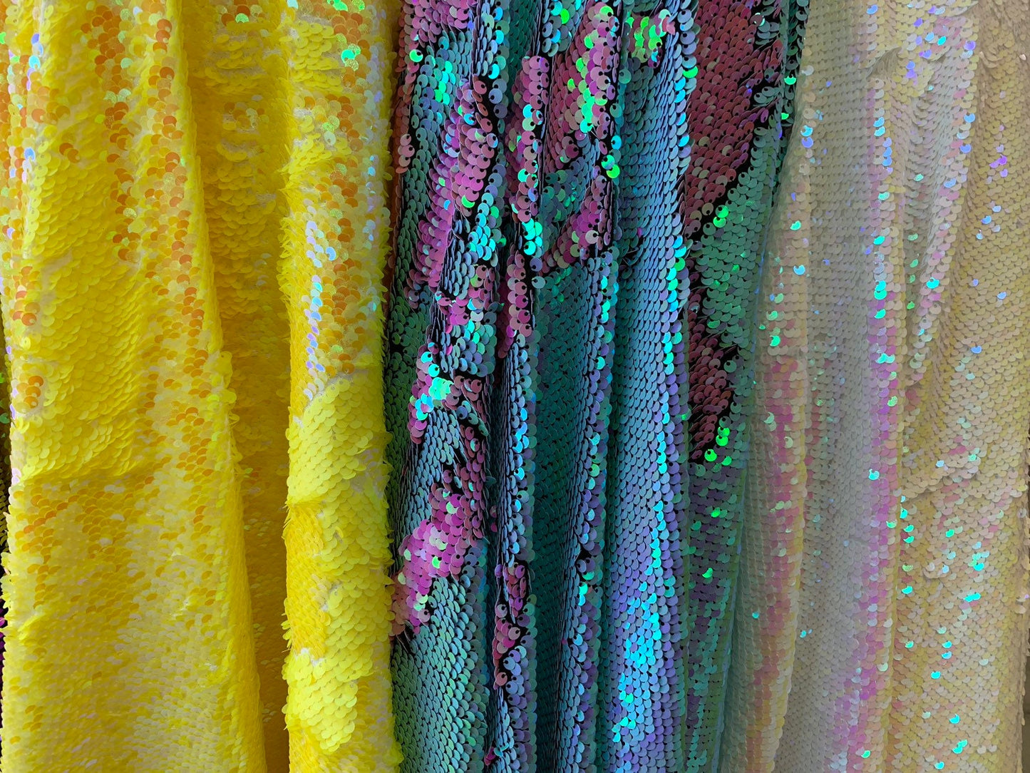 New flip up mermaid reversible sequins iridescent colors on spandex base 58/60" Sold by the YD. Ships worldwide from Los Angeles California
